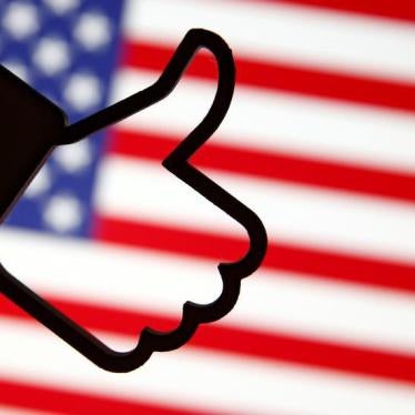 A 3D-printed Facebook Like symbol is displayed in front of a U.S. flag in this illustration taken, March 18, 2018.