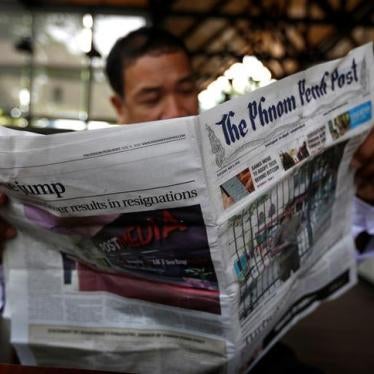 A man reads the Phnom Penh Post at a coffee shop in Phnom Penh, Cambodia, May 8, 2018.