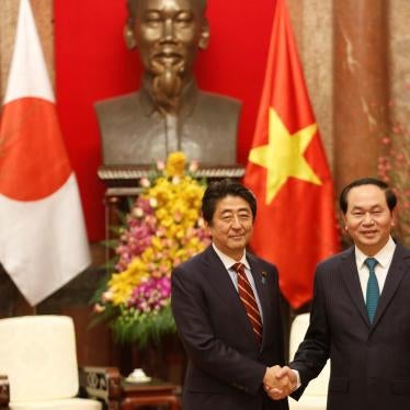Japan’s Prime Minister Shinzo Abe shakes hands with Vietnam’s President Tran Dai Quang at the Presidential Palace in Hanoi, Vietnam, January 16, 2017.