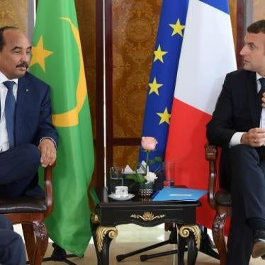 French President Emmanuel Macron talks with Mauritanian President Mohamed Ould Abdel Aziz during a G5 Sahel summit, in Bamako, Mali, July 2, 2017.