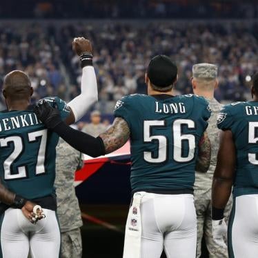 Philadelphia Eagles safety Malcolm Jenkins (27) raises his fist during the national anthem with support from team mate Chris Long (56) prior to the game against the Dallas Cowboys at AT&T Stadium.
