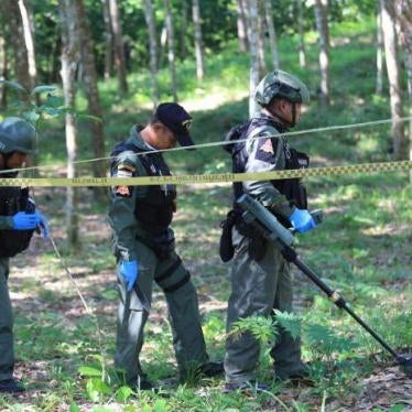 Thai security forces inspect a rubber plantation, where an ethnic Thai Buddist latex tapper lost his foot after stepping on a landmine laid by separatist insurgents in Yala province on July 2, 2018. 