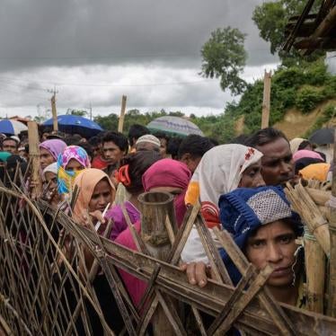 Rohingya refugees line up at an aid relief distribution center at the Balukhali refugee camp near Cox’s Bazar, Bangladesh, August 12, 2018.