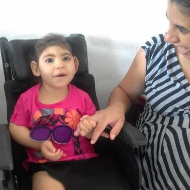 Maria Gabriela Silva Alves (“Gabi”), age 2, with her mother, Maria Carolina Silva Flor (“Carol”), at their home in Esperança, Paraíba state, Brazil in 2018. Gabi was one of thousands of children born with disabilities caused by exposure to the Zika virus 