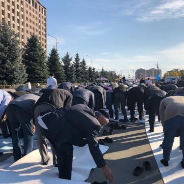 Men praying at the protest rally in Magas, Ingushetia 