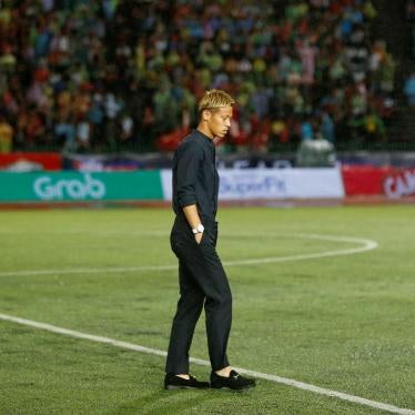 Former Japan football player Keisuke Honda walks on the pitch during his debut as coach of Cambodia's national football team at a friendly match against Malaysia, in Phnom Penh, Cambodia, September 10, 2018. 
