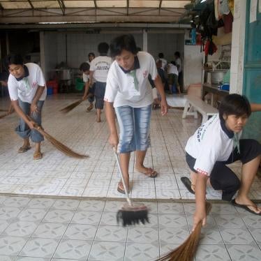 In Malang, Indonesia, prospective domestic workers clean the facilities of their training center prior to migrating for employment in Singapore, Hong Kong, and Taiwan.