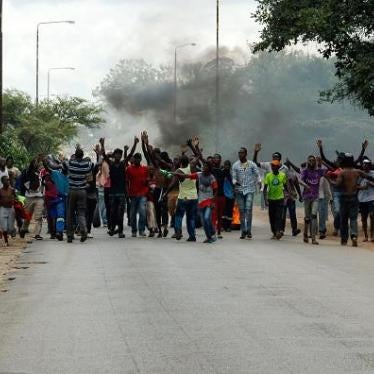 Protesters block the main route to Zimbabwe's capital, Harare, from Epworth township on January 14 2019 after a hike in fuel prices was announced. © 2019 JEKESAI NJIKIZANA/AFP/Getty Images