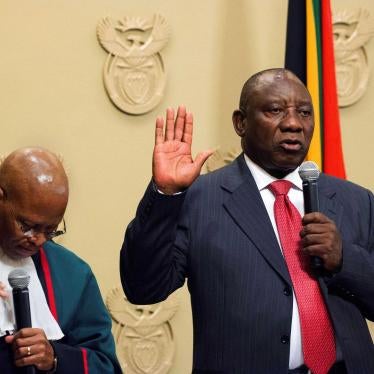 South Africa's new president, Cyril Ramaphosa (right), is sworn into office by South Africa's Chief Justice Mogoeng Mogoeng after being elected by the Members of Parliament at the Parliament in Cape Town, February 15, 2018. © 2018 RODGER BOSCH/AFP/Getty I