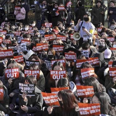 Rally held by supporters of the #MeToo movement on February 25,2018 in Seoul, South Korea, holding a sign that read, “Sexual violence in performing arts sector OUT”. © 2018 Park Jin-hee/ Newsis via AP