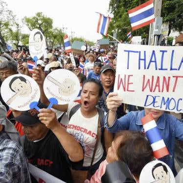 Protesters march near Thammasat University in Bangkok on May 22, 2018, the fourth anniversary of the Thai junta's 2014 coup, demanding that a general election be held this year. (
