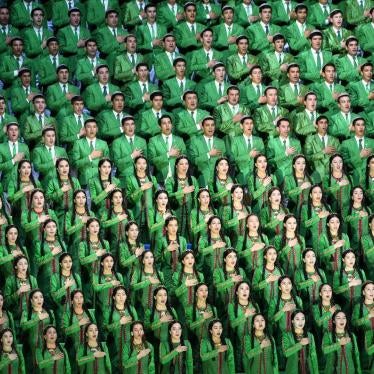 A Turkmen choir dressed in green, the national flag color, sings the national anthem at the opening ceremony of the world weightlifting championships.