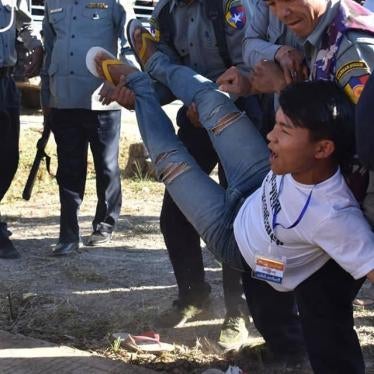 Police carry away a Karenni protester in Karenni State on February 12, 2019.