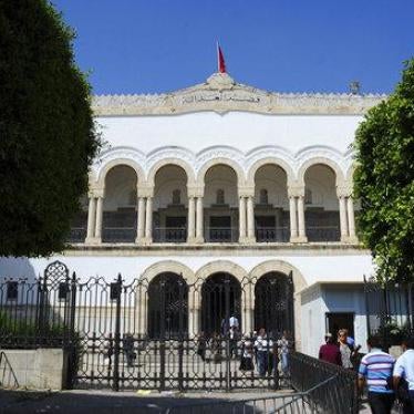 People enter the Tunis hall of justice, Friday May, 26, 2017.