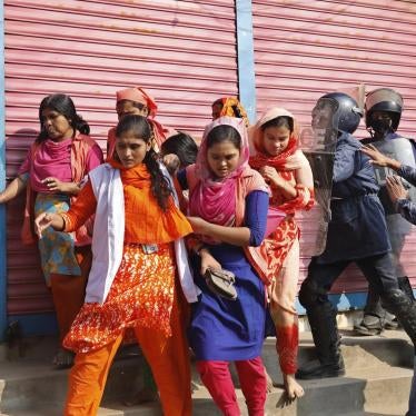 Bangladesh police chase protesting garment workers in Savar, outside Dhaka, Bangladesh, January 9, 2019.