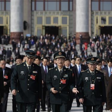 Delegates from China's People's Liberation Army chat as they leave the Great Hall of the People after attending a meeting ahead of Tuesday's opening session of China's National People's Congress in Beijing, Monday, March 4, 2019. 