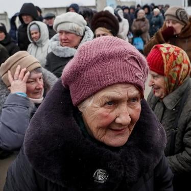 People wait at passport control after crossing the contact line between Russian-backed rebels and Ukrainian troops in Mayorsk, Ukraine, February 25, 2019. 