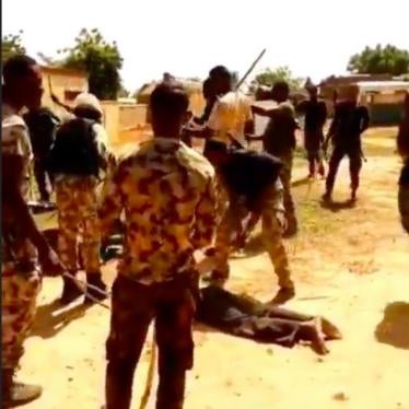 Image from video circulating online, which appears to implicate Nigerian security forces in abuse of a group of men. 