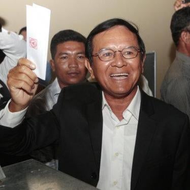 Opposition Cambodia National Rescue Party President Kem Sokha shows off his ballot before voting in local elections in Chak Angre Leu on the outskirts of Phnom Penh, Cambodia, Sunday, June 4, 2017.