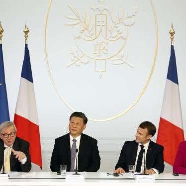 European Commission President Jean-Claude Juncker, Chinese President Xi Jinping, French President Emmanuel Macron, and German Chancellor Angela Merkel hold a press conference in Paris, March 26, 2019.