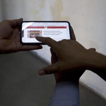 Indians look at a fact-checking website for election related fake news and videos, New Delhi, India, April 3, 2019.