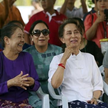 Myanmar's leader Aung San Suu Kyi, right, and first lady Cho Cho, left, smile as they take part in the first day of Myanmar traditional water festival, also known as Myanmar New Year, in Naypyitaw, Myanmar Saturday, April 13, 2019. 