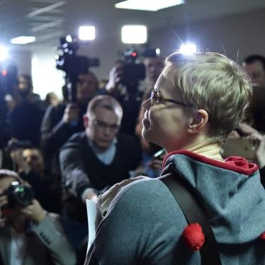 The media photograph Marina Zolotova, editor-in-chief of news portal tut.by, as she attends her trial for alleged 'unauthorised access' to information from state-run BelTA news agency, in Minsk, March 4, 2019.