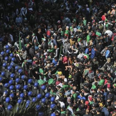 Protesters confront police officers during a demonstration against the country's leadership, in Algiers, Friday, April 12, 2019.