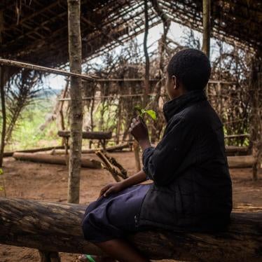 “Tshiela,” aged 10, sits in what was once her school in Mulombela village, Kasai region. The school was attacked by government forces in 2017 and five students were killed.