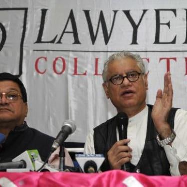 Lawyers Collective co-founder Anand Grover (right) speaks with the media after the Supreme Court's verdict on section 377 of the Indian Penal Code, December 11, 2013, in New Delhi. 