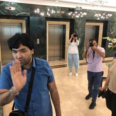 Video blogger Sardor Kamilov (left) accosts Human Rights Watch researcher Steve Swerdlow at a hotel in Tashkent, Uzbekistan, June 13, 2019.