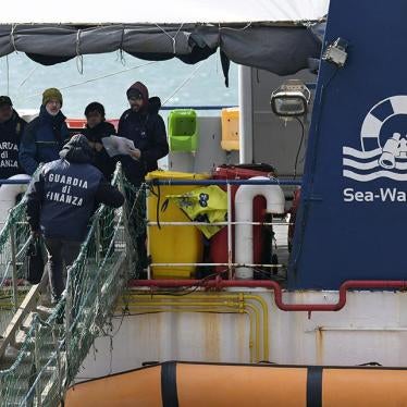Italian Finance Police board the rescue ship Sea-Watch 3 after it disembarked 47 migrants at the Sicilian port of Catania, southern Italy, January 31, 2019.