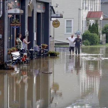 Business owners and workers assess flood waters in Harmony, Pennsylvania. 