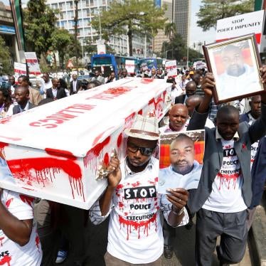 Protesters carry photos of taxi driver Joseph Muiruri, who was killed extrajudicially alongside human rights lawyer Willie Kimani and his client, in Nairobi, Kenya, on July 4, 2016.