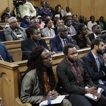 Environmental activists and petitioners listen to a tribunal ruling over the construction of a coal-fired power plant, at the supreme court building in Nairobi, Kenya