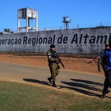 A police officer patrols the surroundings of the Altamira Regional Recovery Centre