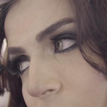 Lebanese Trans woman putting make up on.