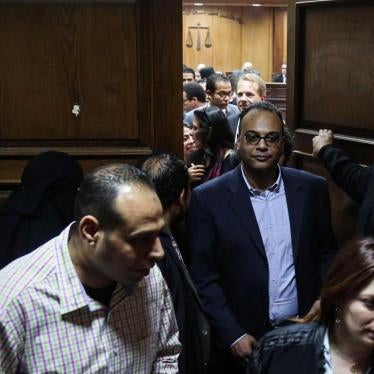 Prominent rights activist and journalist Hossam Baghat, center, leaves a courtroom at the Cairo Criminal Court on March 24, 2016. In recent years, Egyptian authorities have relentlessly prosecuted leading human rights and civil society activists for their