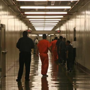 In this April 13, 2009 file photo, detainees leave the the cafeteria at the Stewart Detention Facility immigration facility in Lumpkin, Georgia.