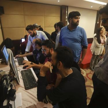 With communications shut down, journalists work inside a media center in Srinagar set up by Jammu and Kashmir authorities, August 18, 2019. 