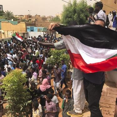 Sudanese protesters gather outside the house of a man killed by security forces on June 3, during a demonstration against the ruling military council.