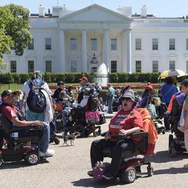 Protesters supporting people with disabilities gather outside the White House in Washington.