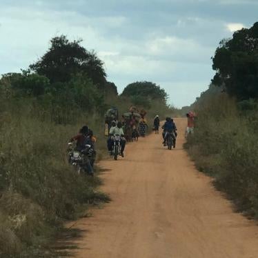 Residents of Naunde, in Macomia, Cabo Delgado, flee their village following an attack on June 5, 2018.