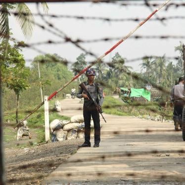A police officer stands guard at a checkpoint in Shwe Zar village, northern Rakhine state, Myanmar, September 6, 2017.