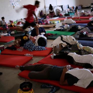Asylum seekers rest at a migrant shelter run by the federal government in Ciudad Juarez, Mexico. 