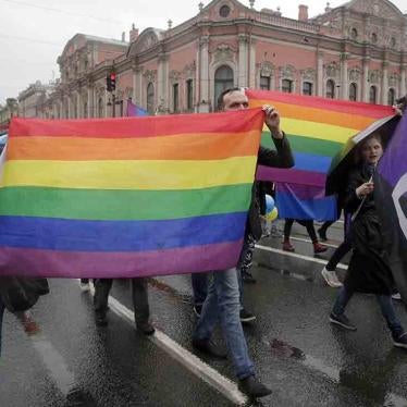 LGBT rights activists carry the rainbow flag during a May Day rally in St. Petersburg, Russia.