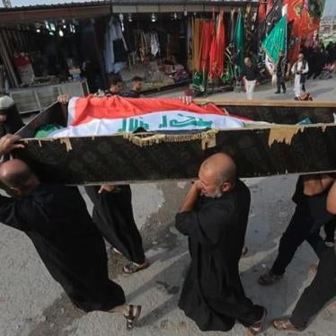 Mourners carry the flag-draped coffin of a protester killed during a demonstration in Najaf, October 8, 2019. 