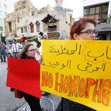 Activists take part in a protest outside the Hbeish police station in Beirut on May 15, 2016.
