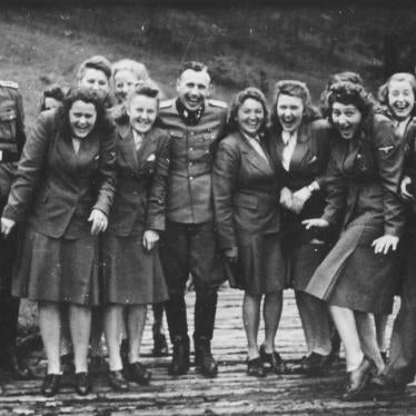 Nazi SS officers and female assistants at an SS resort 18 miles from Auschwitz. Many of those depicted were involved in processing the Jewish deportees who arrived at Auschwitz from Hungary in summer 1944.