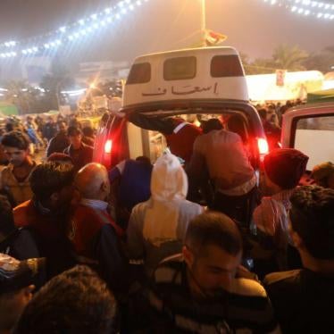 An ambulance arrives in Tahrir square in Baghdad after an attack on protesters in al-Khilani Square late on December 6, 2019. 